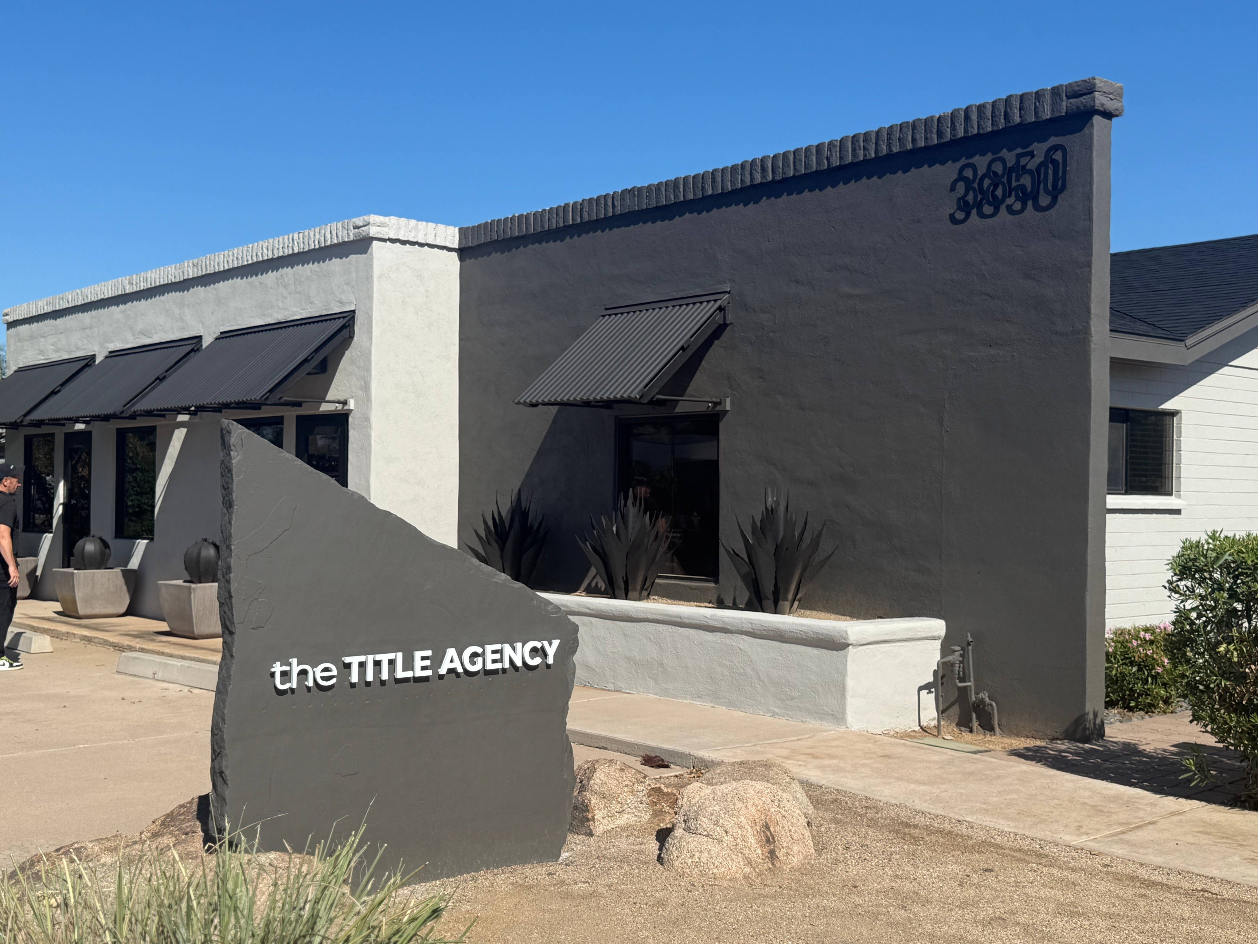 Photo of 3850 E Indian School Rd. the TITLE AGENCY Grey & White building converted house